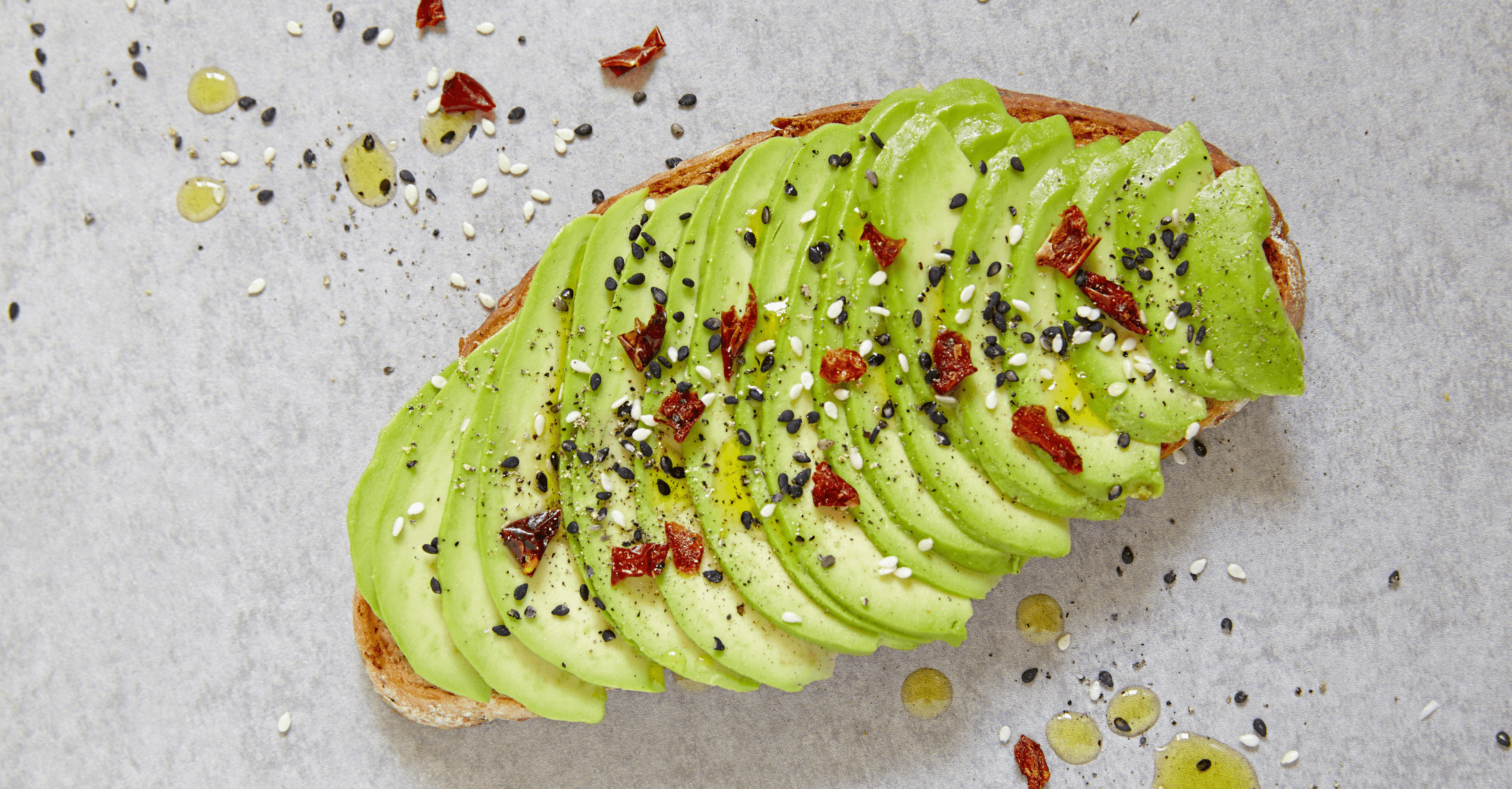 Avocado toast with sesame seeds and red pepper flakes, to indicate this post is about Millennials