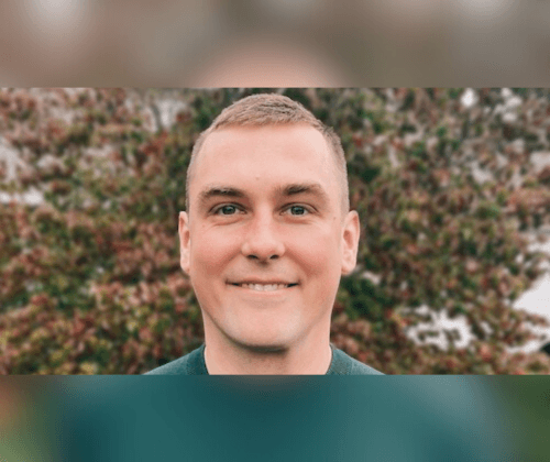 Scott Frey's headshot, younger gentleman in a sweater in front of some leaves