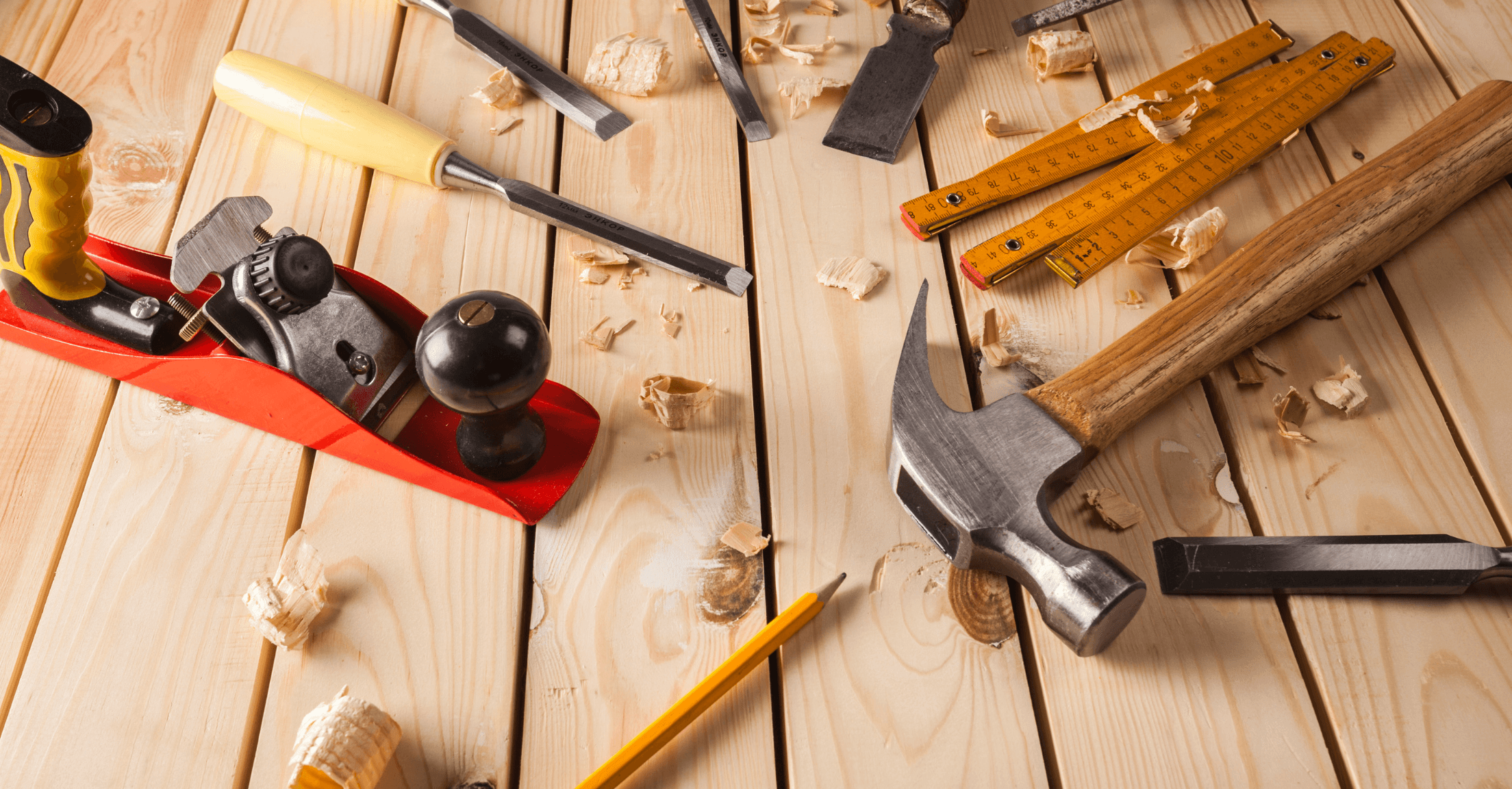 Above view of construction tools such as a ruler and a hammer to indicate updates